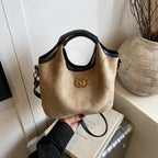 Luxurious suede medium top handle handbag by Trendsi, featuring an elegant design with a shoulder strap and stylish details.
