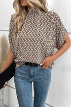 Elegant Trendsi tie-back half-sleeve blouse with side slit, featuring a stylish design and lightweight fabric.