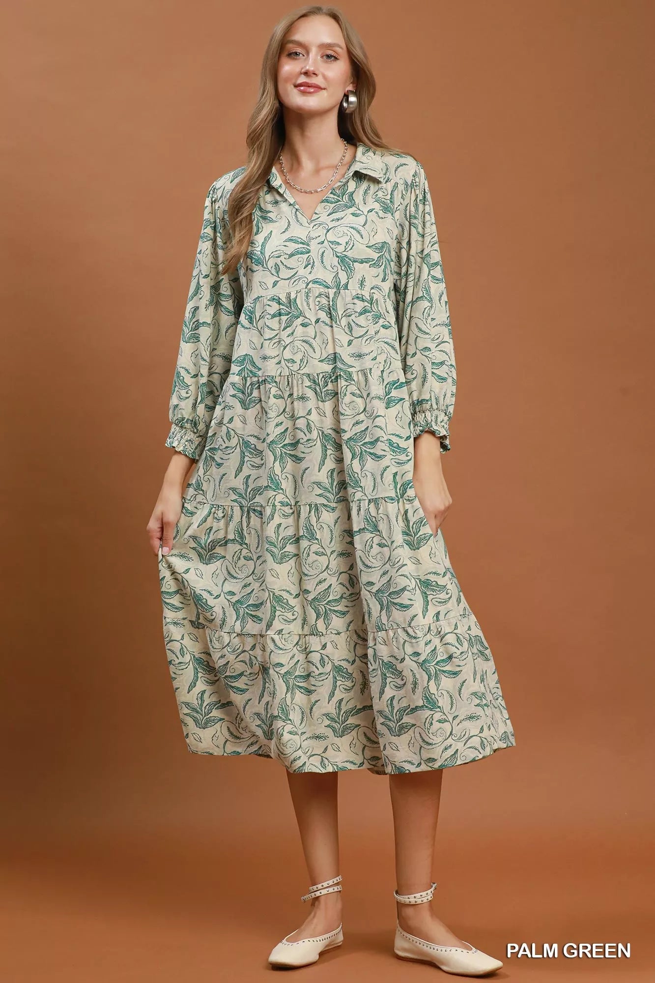 Umgee linen botanical print tiered midi dress in soft fabric with a flowy silhouette and tiered skirt design.