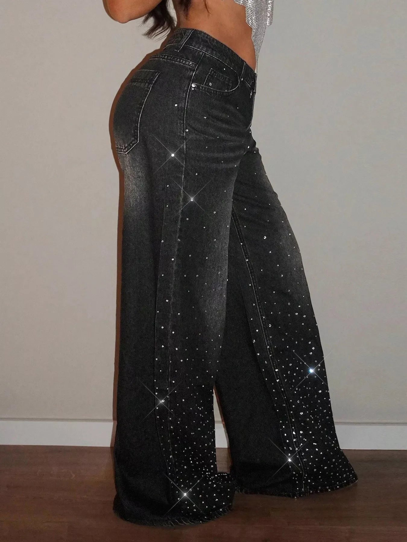 Rhinestone wide-leg jeans from Trendsi featuring embellished rhinestones along the waistband and flowing wide-leg silhouette.