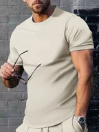 Men's plus size solid color casual T-shirt by Trendsi, front view showing round neckline and short sleeves.