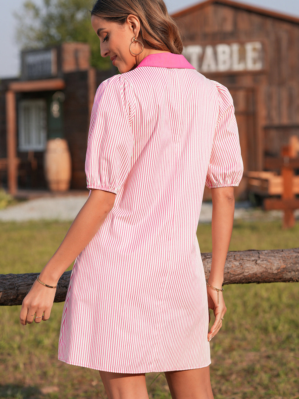 Stripe color block puff sleeve button-down mini dress by Trendsi featuring a fitted silhouette, vibrant stripes, and stylish puff sleeves.