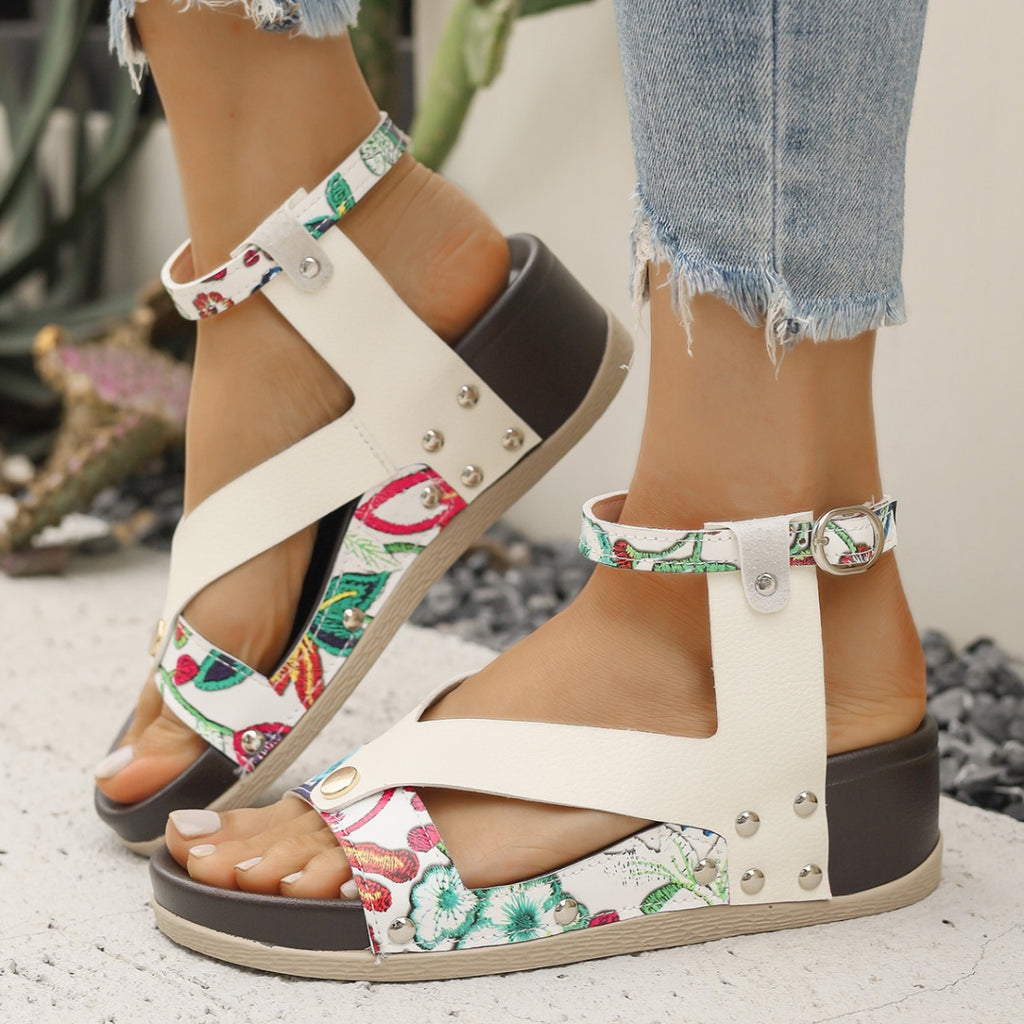 Women's leopard print wedge sandals with ankle straps from Trendsi, featuring a comfortable summer design and stylish footwear.