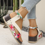 Women's leopard print wedge sandals with ankle straps from Trendsi, featuring a comfortable summer design and stylish animal print.