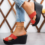 Open toe wedge sandals by Plush Fashion Hub featuring a stylish design with a comfortable wedge heel and open toe style.