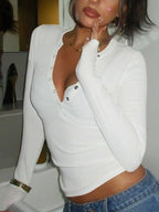 Women's ribbed knit button-front long sleeve T-shirt from Trendsi, featuring a fitted design and classic ribbed texture.