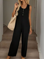 Sleeveless button-front wide-leg jumpsuit by Trendsi, featuring a comfortable, chic design and relaxed fit perfect for casual wear.