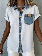 Denim trim short sleeve shirt from Trendsi, casual top with denim accents and short sleeves, displayed on a hanger.