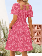 Women's casual smocked tiered square neck short sleeve dress with pockets by Trendsi, featuring a relaxed fit and stylish design.