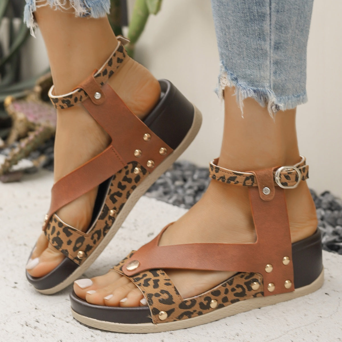 Women's leopard print ankle strap wedge sandals from Trendsi, featuring comfortable summer footwear with a stylish animal print design.