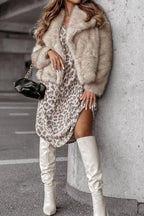Leopard print V-neck long sleeve dress from Trendsi featuring a fitted silhouette and stylish design.