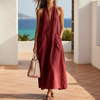 Cotton FitiqueFit halterneck sleeveless dress with deep V-neck, loose fit, straight-line casualwear perfect for warm weather.