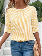Women's striped ruffled round neck half sleeve blouse by Trendsi, showing a stylish top with ruffle details and a round neckline.