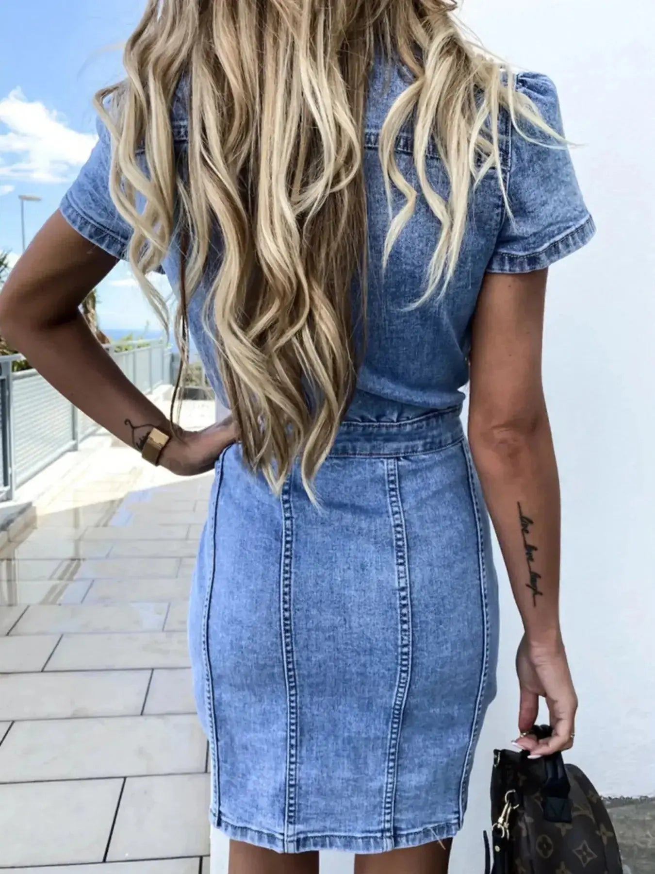 Button-front short sleeve denim midi dress by Trendsi, featuring soft stretch fabric and casual style, perfect for everyday wear.