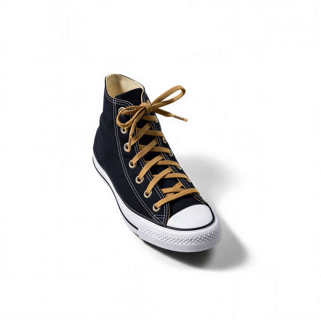Elastic shoelace in coyote brown color by Bread, shown with the laces threaded through shoe eyelets.