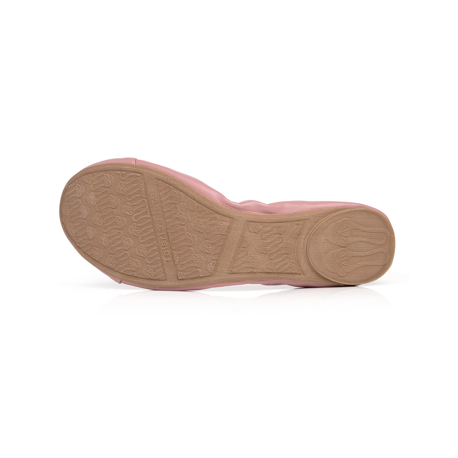 Dusty rose ballet flat shown from the bottom, featuring a tan rubber sole with a textured bow-print grip pattern.