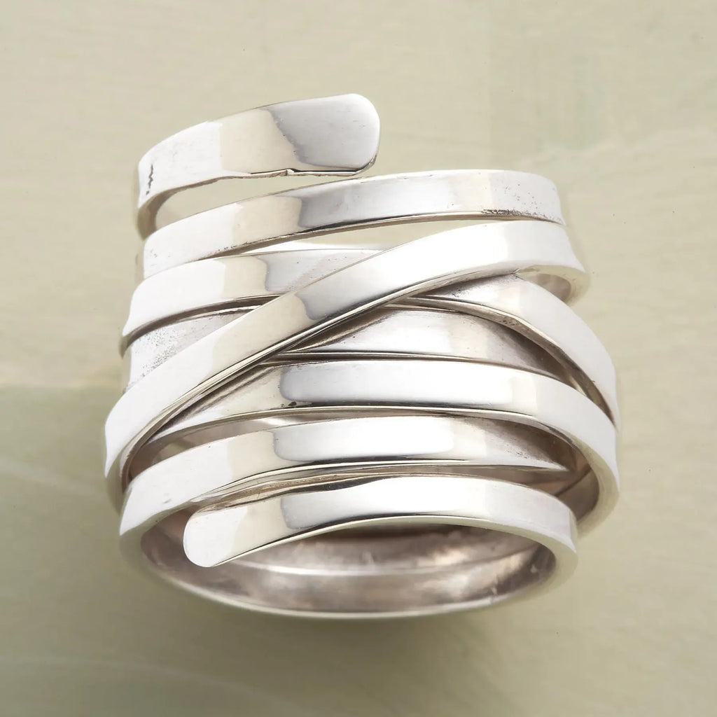 Silver-tone geometric winding hoop ring with modern design, crafted by Plush Fashion Hub, displayed on a neutral background.
