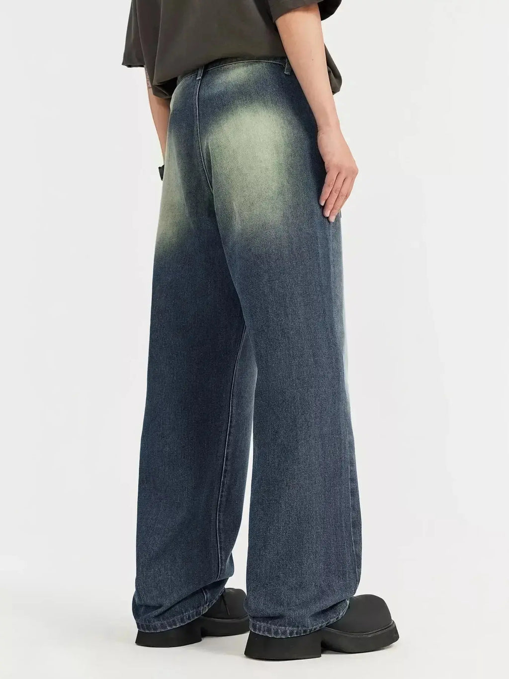 Men's vintage wash wide-leg denim jeans with a relaxed fit, made from durable cotton, by Trendsi.