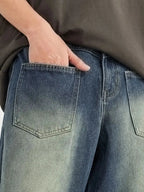 Men's vintage wash wide-leg denim jeans by Trendsi with relaxed fit, cotton construction, and classic denim style.