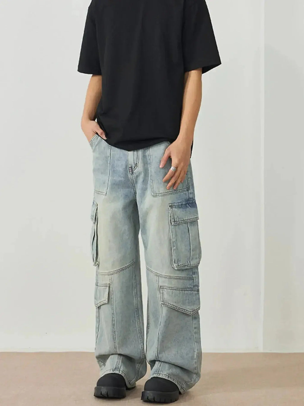 Men's wide leg cargo utility jeans in relaxed fit denim, featuring multiple pockets and streetwear style, by Trendsi.