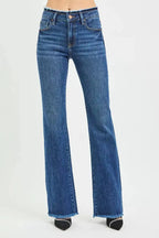 Mid-rise bootcut jeans with frayed waist and raw hem detail from Trendsi, showing the denim fabric and distressed design.