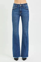 Mid-rise bootcut jeans with frayed waist and raw hem detail, stylish denim pants by Trendsi.