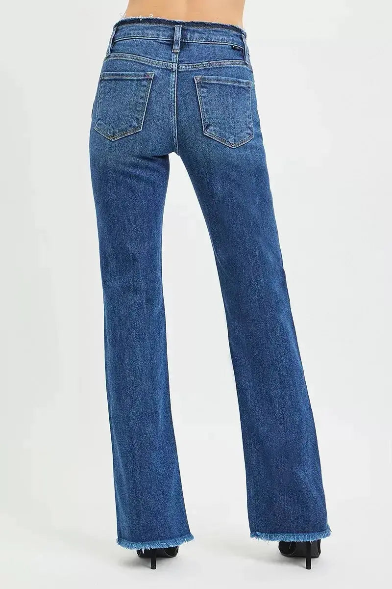 Mid-rise bootcut jeans by Trendsi with frayed waist and raw hem detail, showcasing classic denim style and distressed accents.