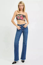 Mid-rise bootcut jeans with frayed waist and raw hem detail, featuring classic denim texture and trendy style from Trendsi.