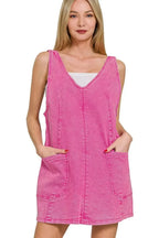 Pink washed denim overall dress with adjustable straps, casual style, by Trendsi, perfect for a relaxed, trendy look.