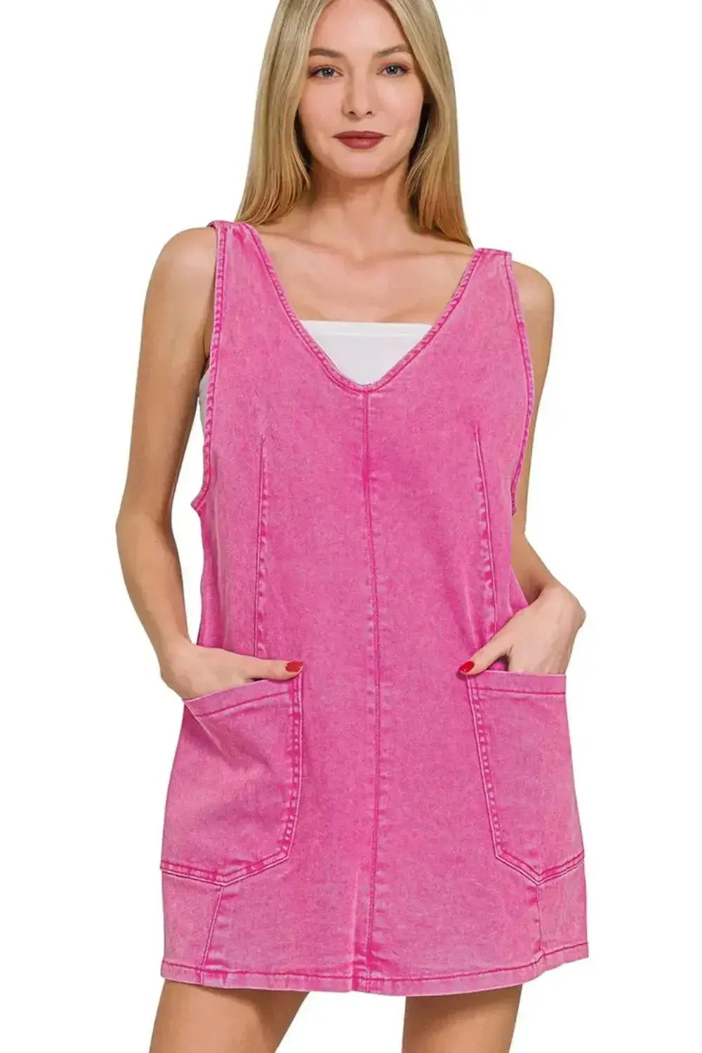 Pink washed denim overall dress with adjustable straps, casual style, by Trendsi, perfect for a relaxed, trendy look.