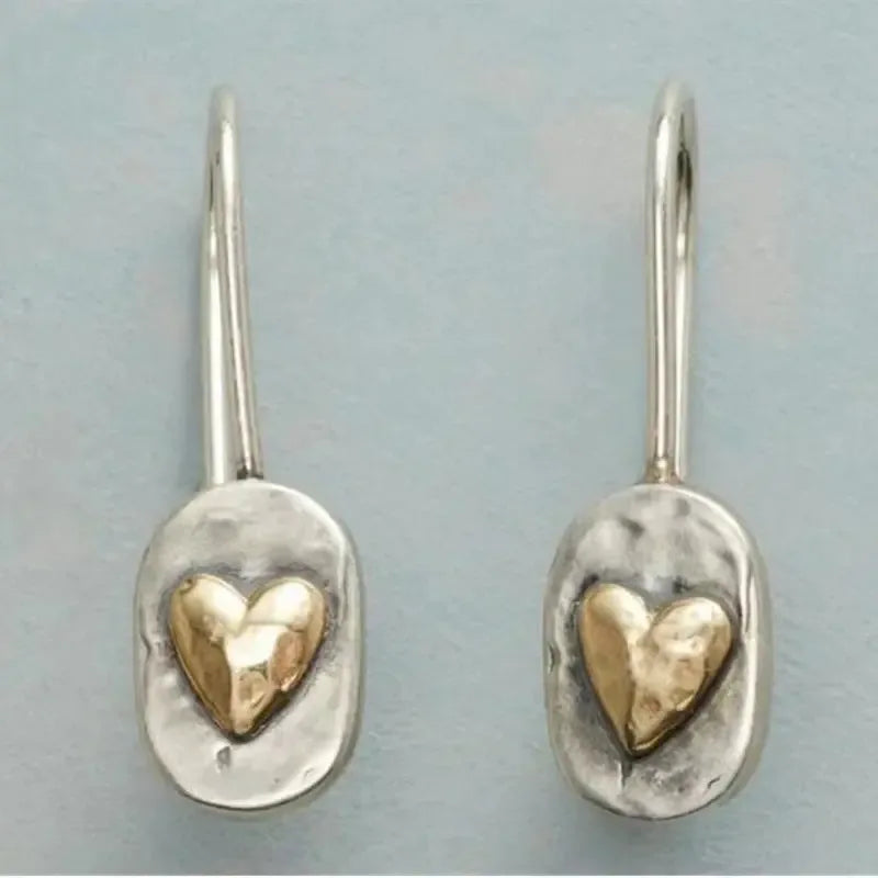Polished silver minimalist geometric love heart earrings with a sleek, modern design from Plush Fashion Hub.