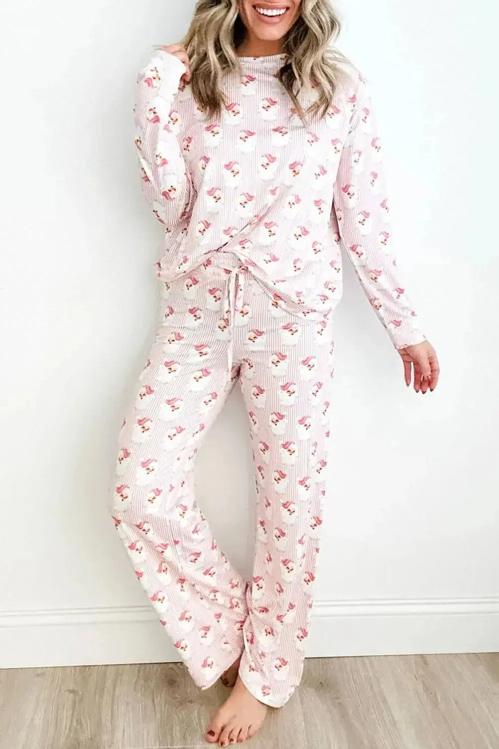 Women's festive Santa print long sleeve pajama lounge set by Trendsi, featuring cozy holiday-themed pajamas with Santa design.