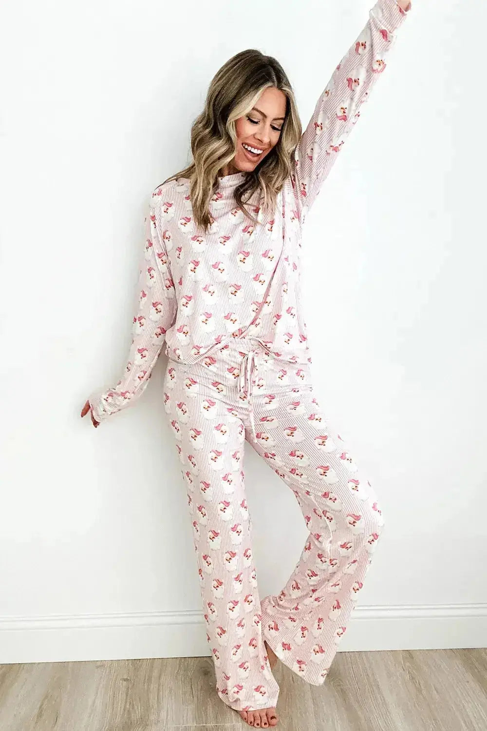 Women’s festive Santa print long sleeve pajama lounge set by Trendsi, featuring cozy holiday-themed pajamas with Santa design.
