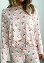 Women’s festive Santa print long sleeve pajama lounge set by Trendsi, featuring cozy holiday-themed pajamas with red and white Santa design.