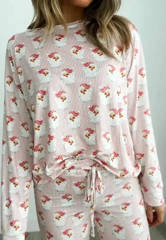 Women’s festive Santa print long sleeve pajama lounge set by Trendsi, featuring cozy holiday-themed pajamas with red and white Santa design.