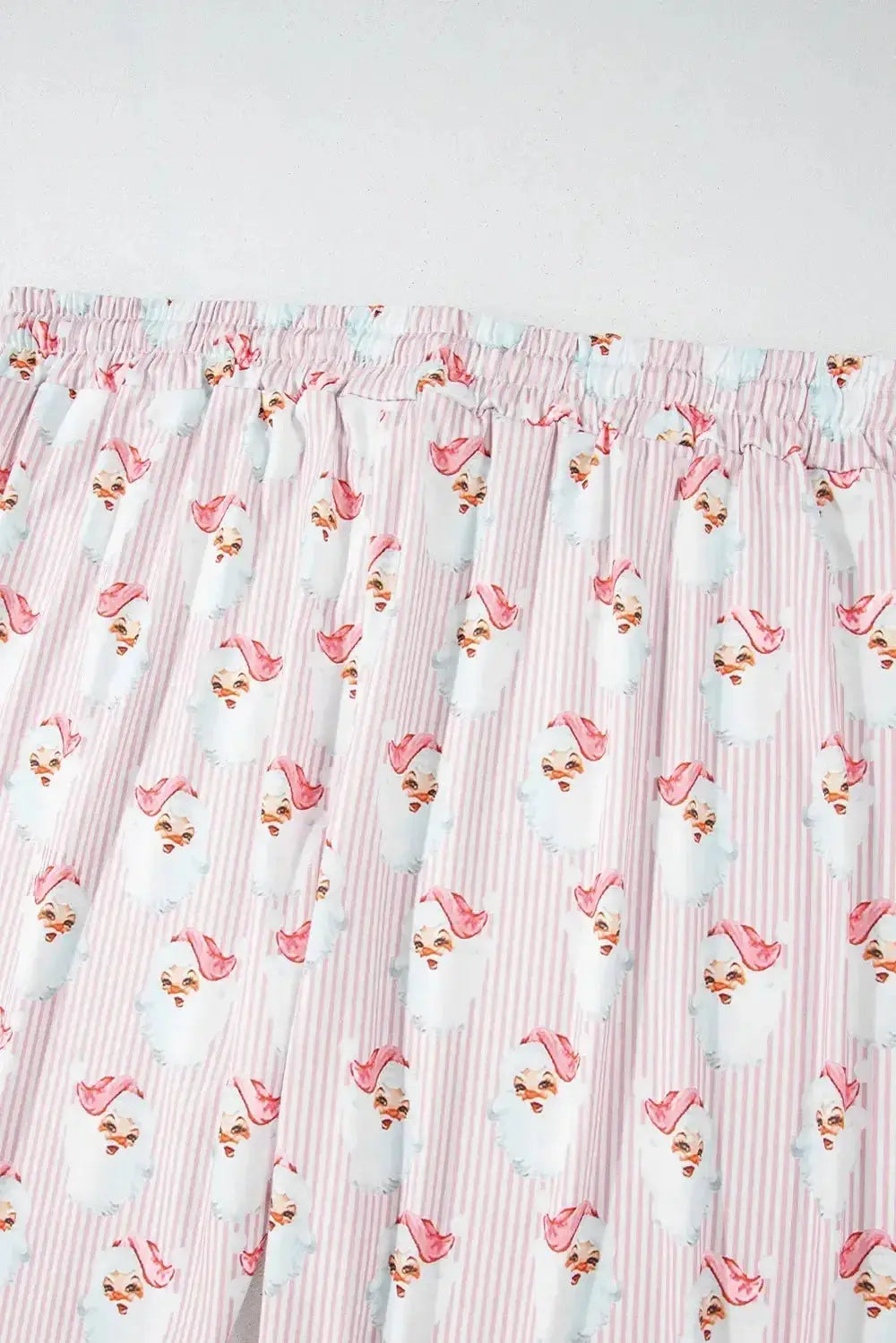 Women’s festive Santa print long sleeve pajama lounge set by Trendsi, featuring cozy holiday-themed pajamas for women.