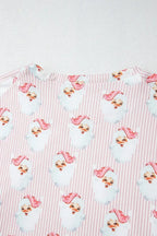 Women's festive Santa print long sleeve pajama lounge set by Trendsi, featuring cozy holiday-themed sleepwear with red and white Santa design.