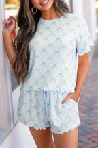 Women’s printed round neck lounge set with soft pajama top and shorts, comfortable sleepwear from Trendsi.