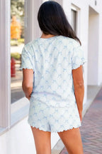 Women’s printed round neck lounge set with soft pajama top and shorts, comfortable sleepwear from Trendsi.