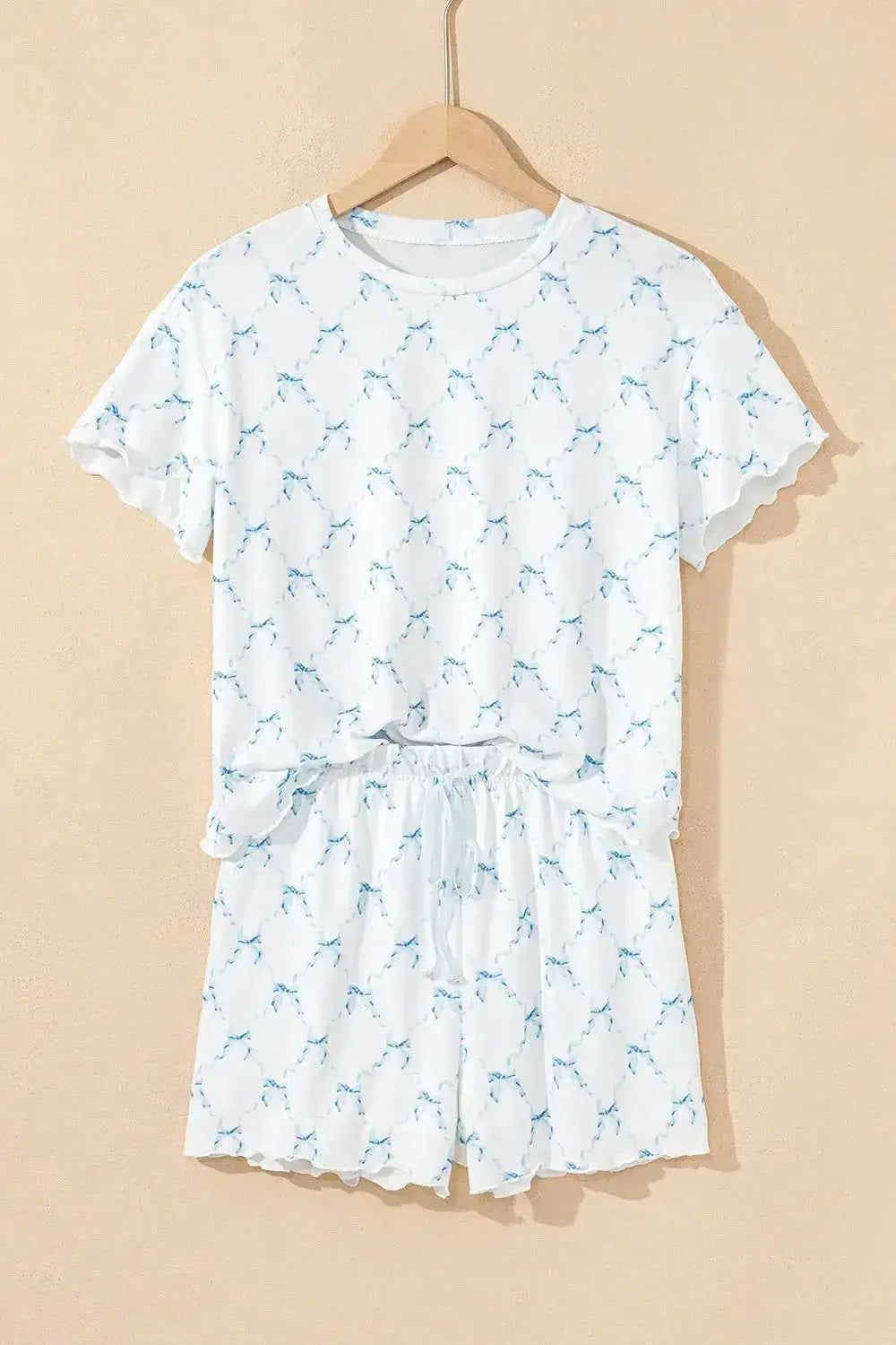 Women's printed round neck lounge set by Trendsi, soft pajama top and shorts for comfortable relaxed wear.