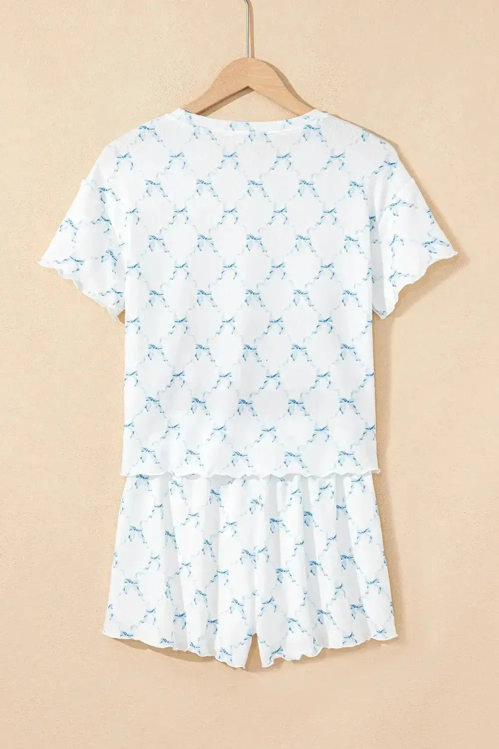 Women’s printed round neck lounge set with soft pajama top and shorts, featuring comfortable fabric and casual style.