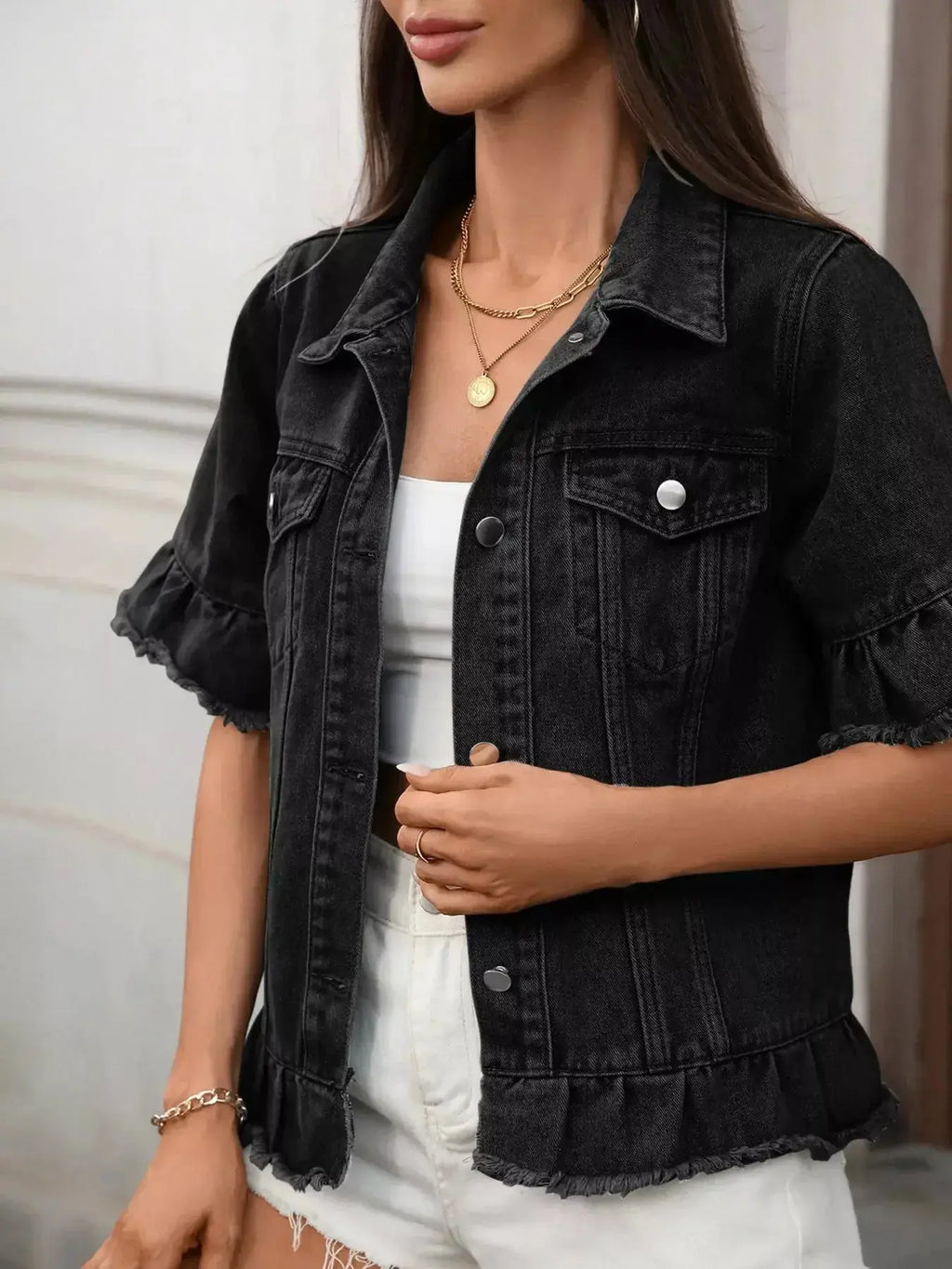 Women's raw hem ruffled denim jacket by Trendsi, stylish button-up jean jacket with ruffle details and distressed hem.