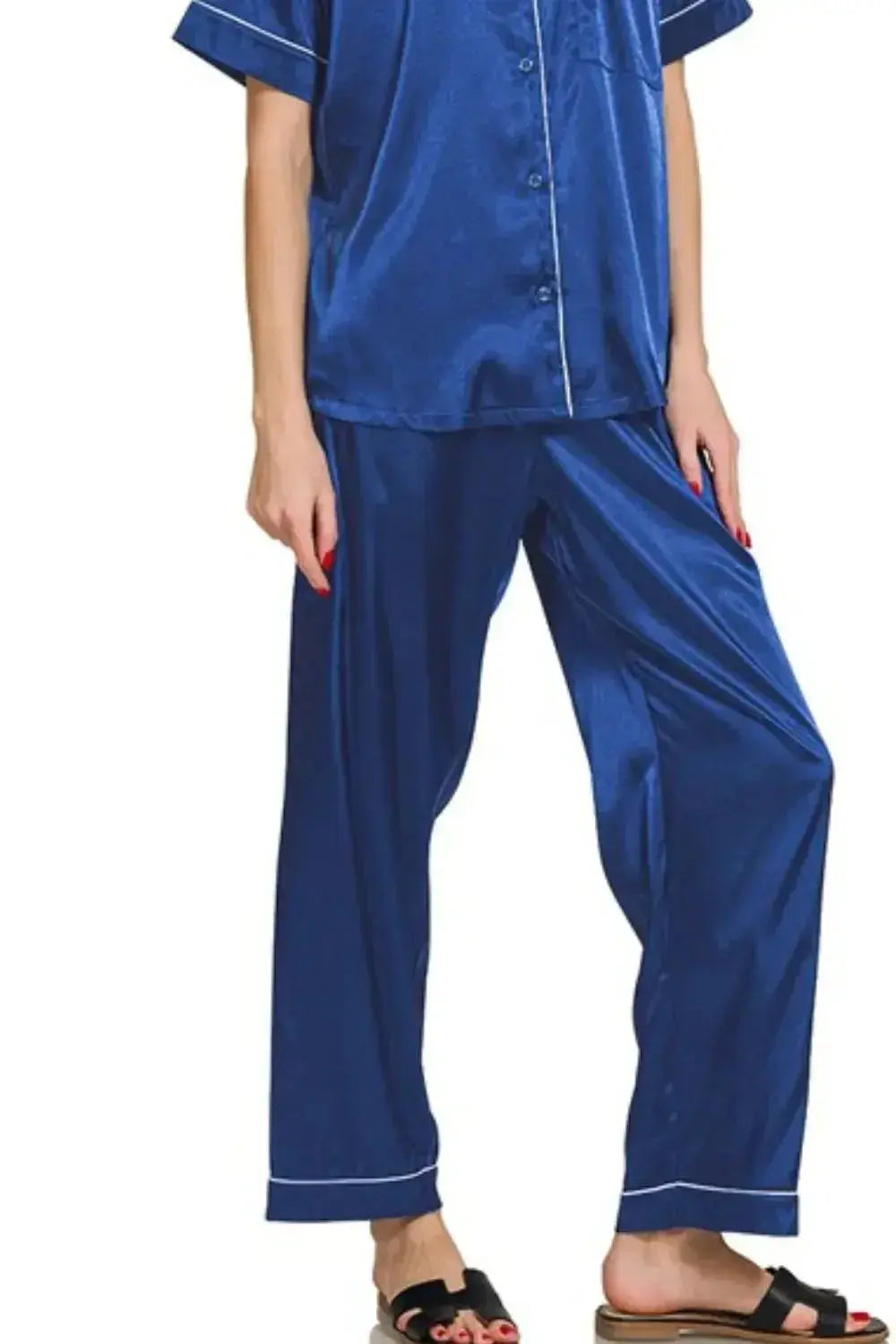 Women's royal blue satin pajama set with short sleeves and button-down top, comfortable sleepwear from Trendsi.