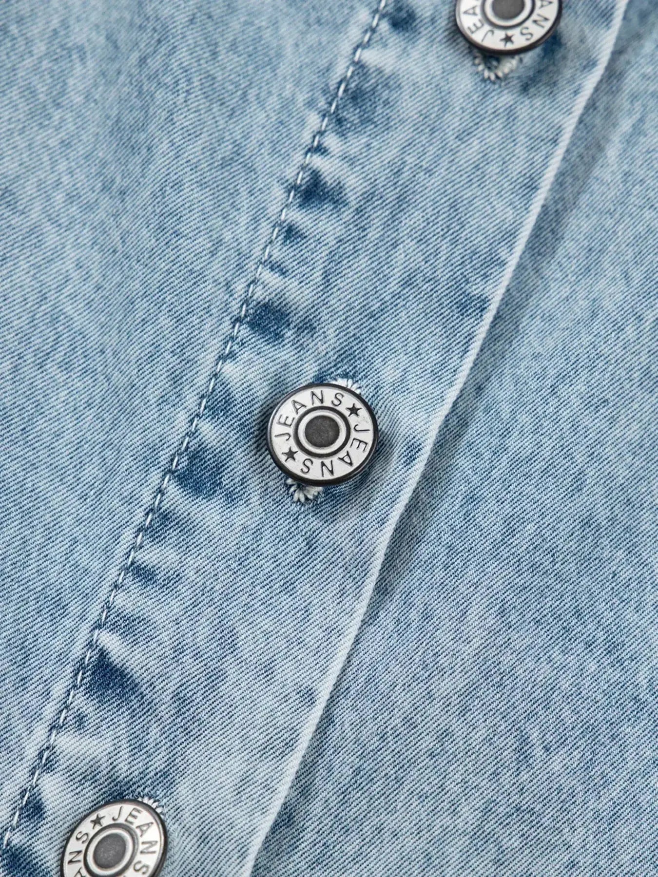 Women’s tiered flowy denim overall dress with raw hem, made from 100% cotton, by Trendsi, featuring a relaxed fit and casual style.