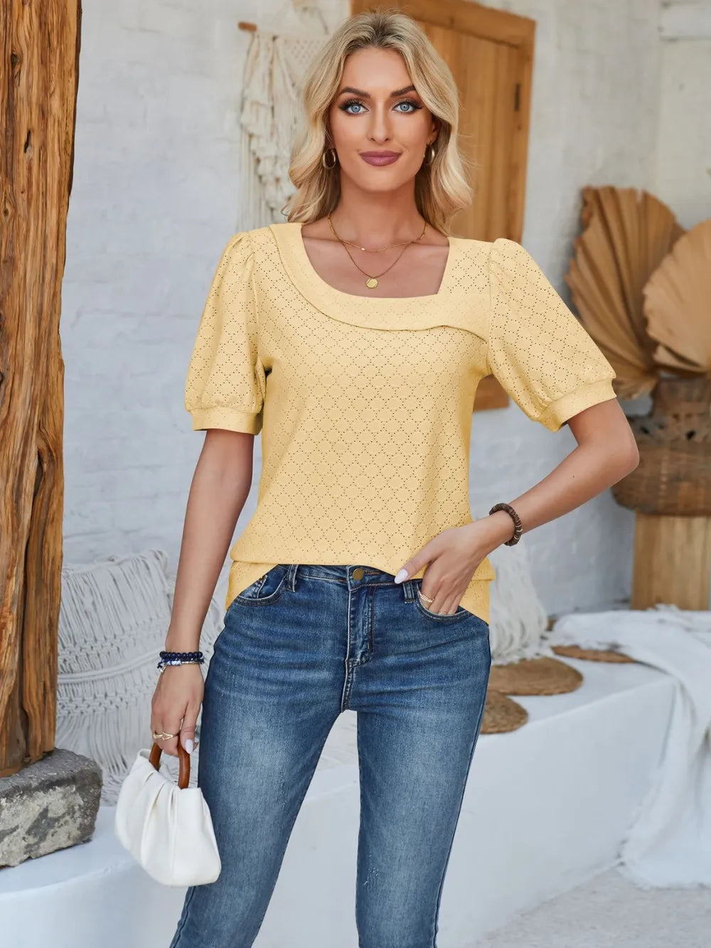 Trendsi eyelet asymmetrical neck short sleeve T-shirt, stylish tops with unique neckline and casual fit, displayed on a hanger.