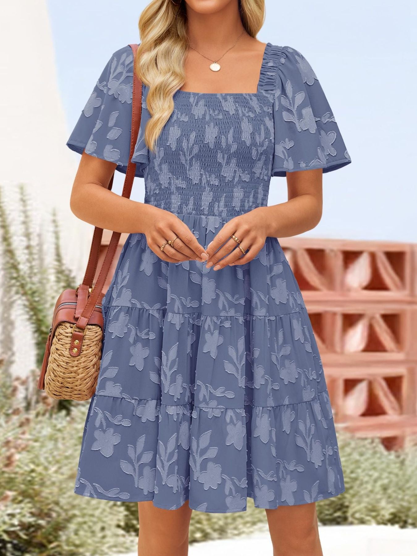 Women's smocked tiered square neck short sleeve casual dress with pockets by Trendsi, featuring a feminine neckline and comfortable fit.