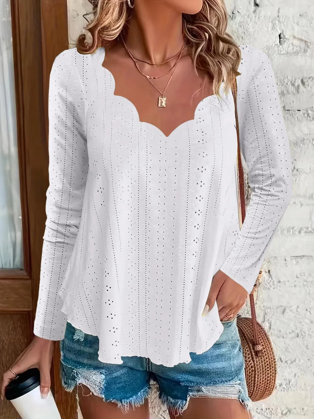 Elegant women's eyelet long sleeve blouse by Trendsi, featuring a versatile stretchy office top with detailed eyelet design.