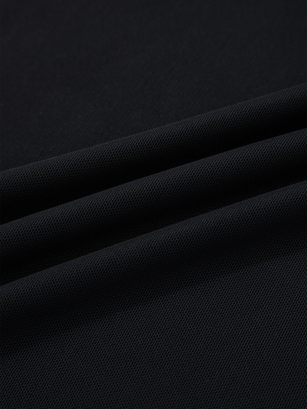 Women's sheer mesh patchwork cap sleeve T-shirt from Trendsi, featuring elegant layering design and lightweight, breathable fabric.