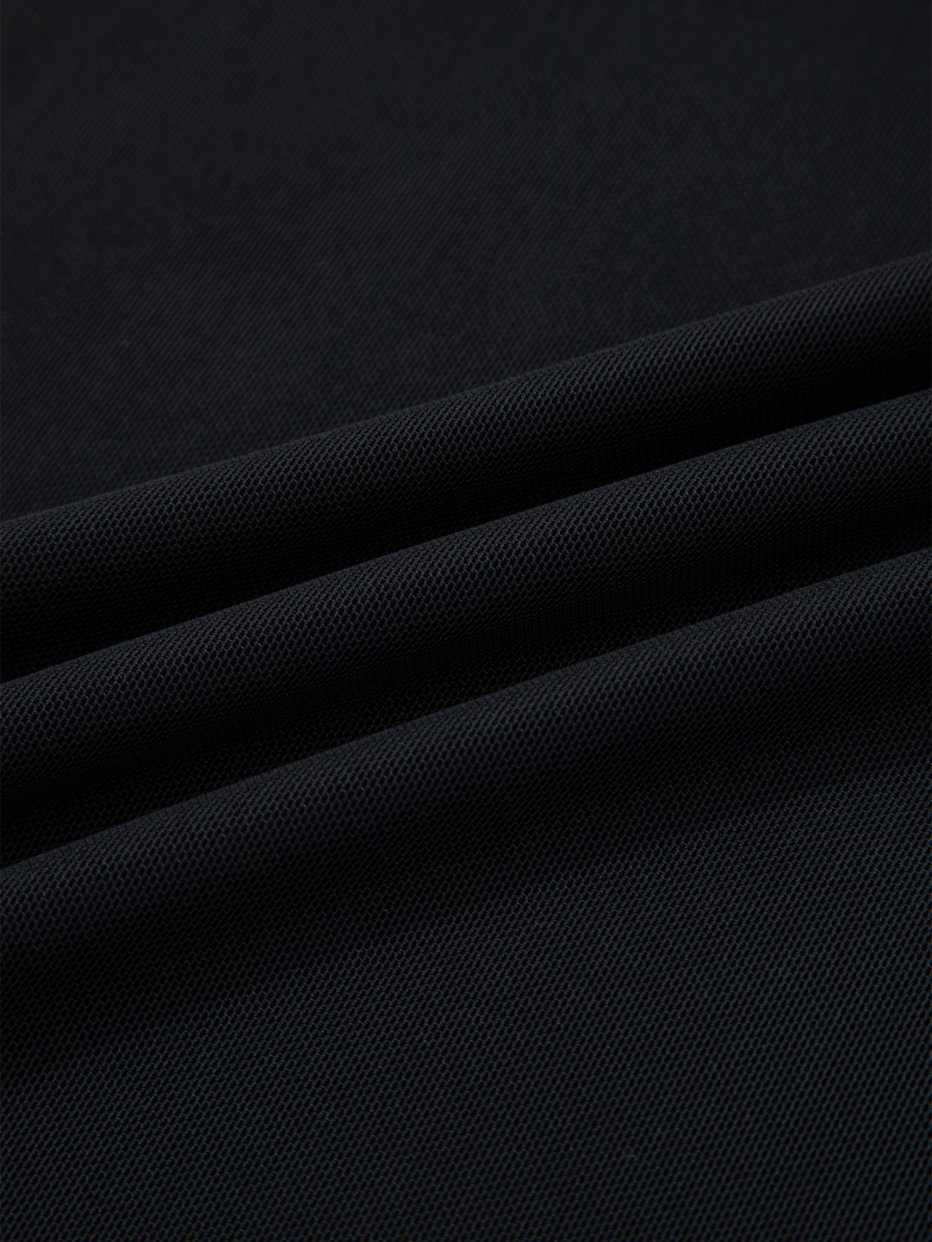 Women's sheer mesh patchwork cap sleeve T-shirt from Trendsi, featuring elegant layering design and lightweight, breathable fabric.