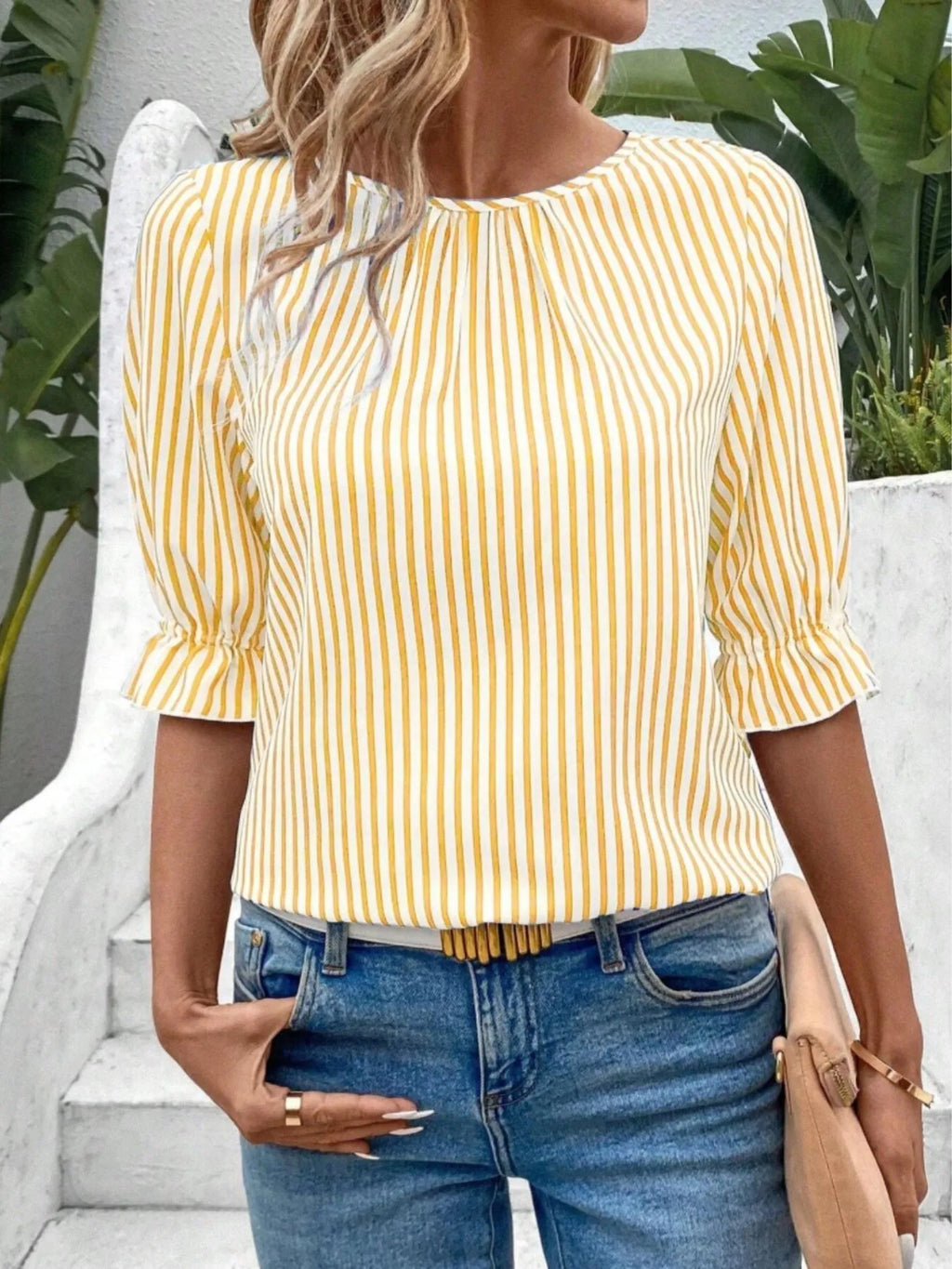 Women's striped ruffled round neck half sleeve blouse from Trendsi, featuring a stylish design and comfortable fit.